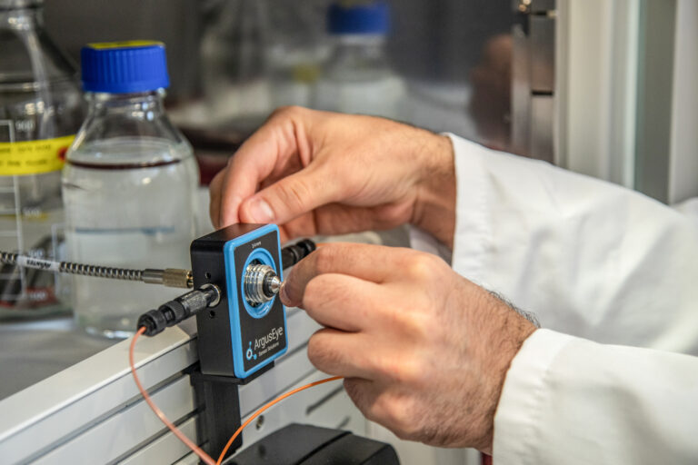 Inserting sensor chip in flow cell.